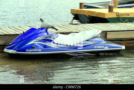A blue seadoo in a small lake in Ontario Stock Photo