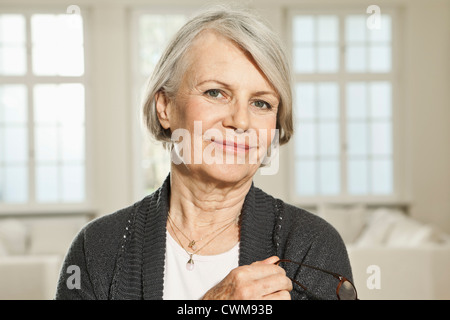 Germany, Berlin, Senior woman with spectacles, portrait Stock Photo