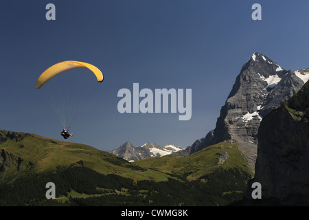 Paraglider close to the Eiger Northface in Switzerland Stock Photo