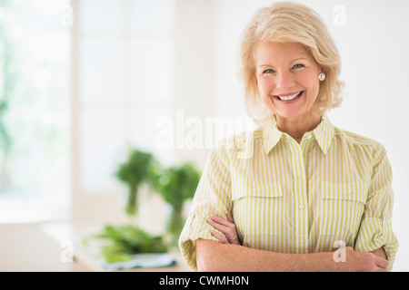 USA, New Jersey, Jersey City, Portrait of mature woman in kitchen Stock Photo