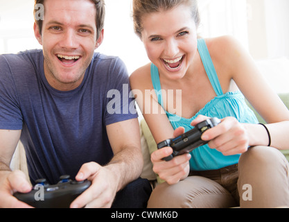 USA, New Jersey, Jersey City, Young couple playing computer games Stock Photo