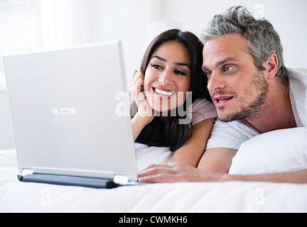 USA, New Jersey, Jersey City, Couple using laptop Stock Photo