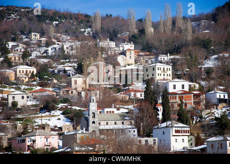 Mountain village Agios Georgios with snowcapped houses in winter (Pelion peninsular, Thessaly, Greece) Stock Photo