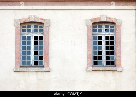 two old windows with broken glasses Stock Photo