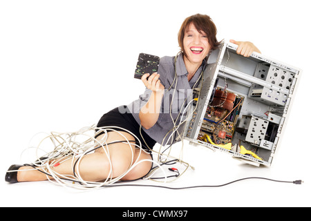ecstatic woman holding hard disk drive and computer Stock Photo