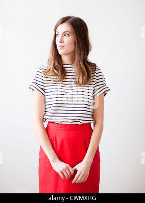 Studio shot of young woman looking away Stock Photo