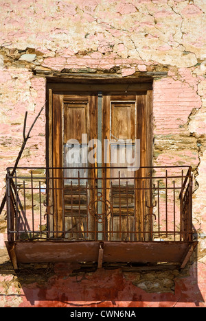 Balcony of an old stone house with weathered wooden door on Pelion Peninsular, Thessaly, Greece Stock Photo