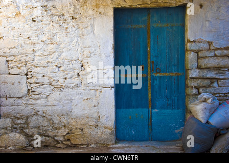 Wooden door of an old stone house on Pelion Peninsular, Thessaly, Greece Stock Photo