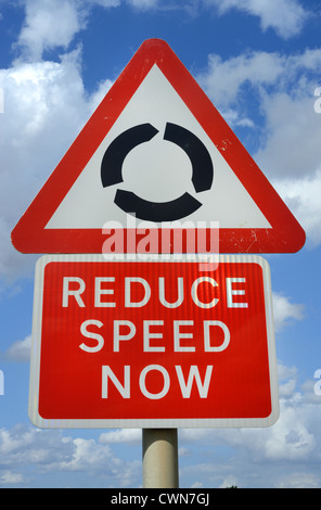 reduce speed warning  roadsign before roundabout ahead uk Stock Photo