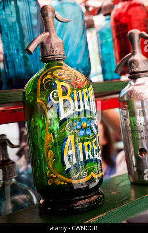 Soda siphons on sale at a stall in Plaza Dorrego during the Sunday Market in San Telmo, Buenos Aires, Argentina. Stock Photo
