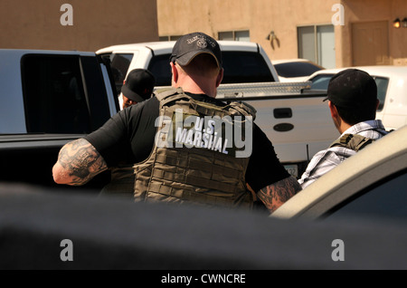 Undercover and law enforcement officers from a multi-task force conduct a drug bust in Tucson, Arizona, USA. Stock Photo