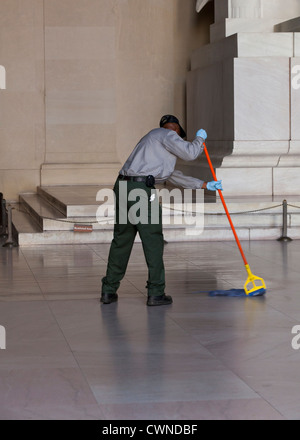 Man mopping a floor Stock Photo