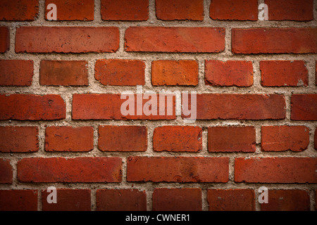 old red brick wall background with shadows in corners Stock Photo