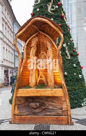 Christmas and New Year market in Prague, Czech Republic - nativity scene wooden crib and Christmas tree Stock Photo