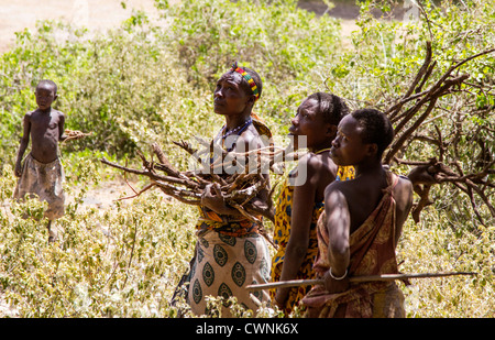 The Hadza, or Hadzabe, are an ethnic group in north-central Tanzania, living around Lake Eyasi. These women are gathering roots. Stock Photo