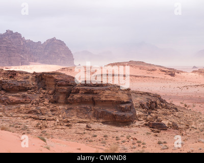 Panorama from the Wadi Rum desert in Jordan showing sand rocks mountain and approaching sandstorm Stock Photo