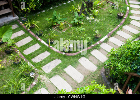 Stone paved footpath through garden Stock Photo