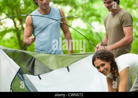Young campers setting up tent Stock Photo