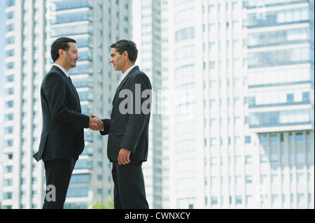 Business executives shaking hands Stock Photo