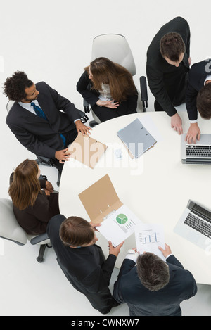 Business associates reviewing documents together Stock Photo