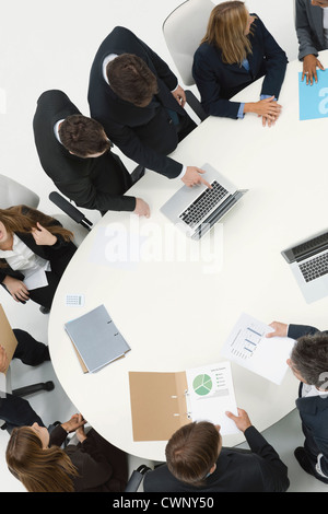 Business associates in meeting, overhead view Stock Photo