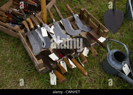 Selection of billhooks in a wooden tray Stock Photo