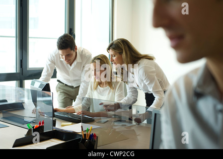 Colleagues collaborating in office Stock Photo