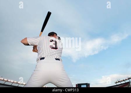 Baseball player preparing to bat, rear view Stock Photo