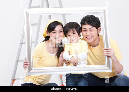 Happy family doing DIY home improvement Stock Photo