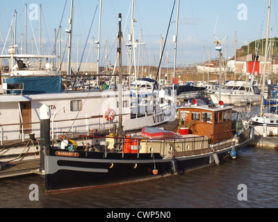 Old boat in Watchet Harbour. Somerset. UK Stock Photo