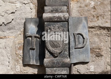 Lead pipework in keeping with architectural restoration practice ties in with brickwork Stock Photo