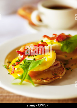 Photo of morning food, image of fried delicious egg with green salad and slice ham, picture of fresh breakfast with cup of tea Stock Photo