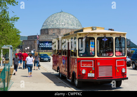 Gray Line trolley tour in front of the Adler Planetarium on the Museum Campus in Grant Park, Chicago, Illinois, USA Stock Photo