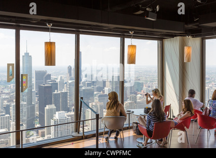 Tourists looking out over city skyline from the 360 Chicago observatory on John Hancock Center, N Michigan Avenue, Chicago, Illinois, USA Stock Photo