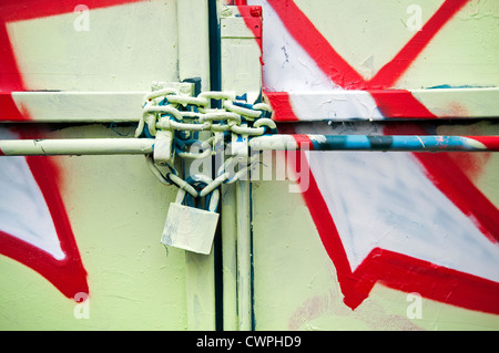 Graffiti sprayed on chain and padlock Stock Photo