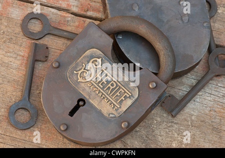 Old iron lock reproduction with keys engraved in script with Sheriff. Stock Photo