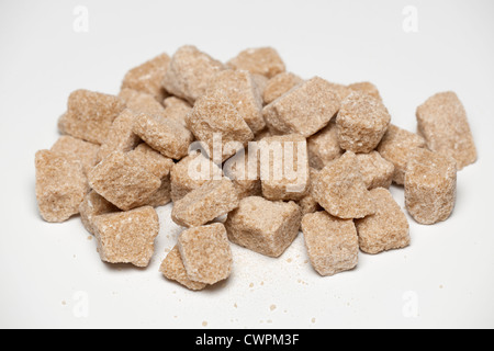 Pile of natural unrefined cane sugar Demerara rough cut cubes Stock Photo
