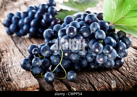 Grapes on a old wooden table. Stock Photo