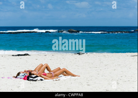 Sunbathing on the beach of Camps Bay, Cape Town, South Africa Stock Photo