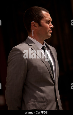 Close protection officer standing guard Stock Photo