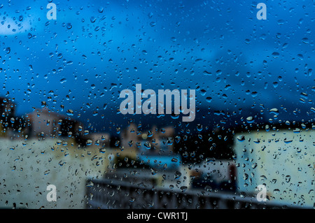 Raindrops on a window pane. Stock Photo
