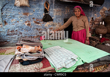 asia, asian, india, woman ironing cloth with an old fashioned metal iron  Stock Photo - Alamy