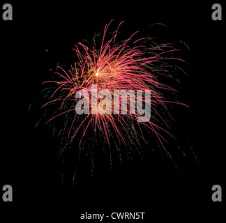 multiple fireworks explode in a burst with black background Stock Photo