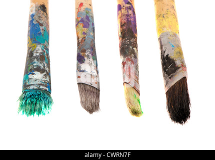 Dirty wooden paint brushes isolated on white background. Stock Photo