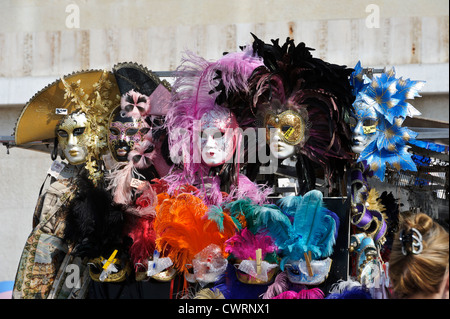 Colourful Venetian face masks on sale, St Mark's Square, Venice, Italy. Stock Photo