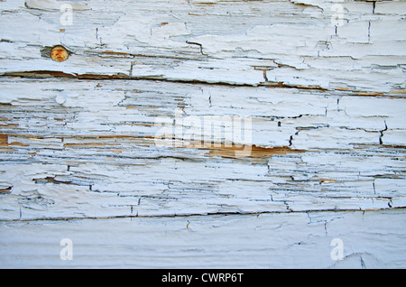 old weathered and cracked painted wood surface background Stock Photo