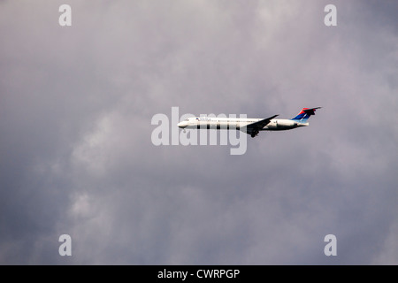 Delta jet airplane coming in for landing in Portland, Maine. Stock Photo