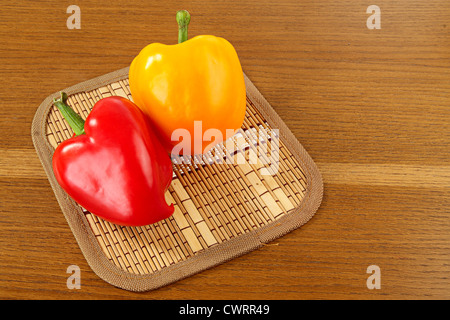 Sweet peppers on wooden background Stock Photo