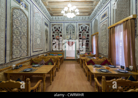 19th century dining room of hotel  in traditional style, Amelia Hotel, Bukhara, Uzbekistan Stock Photo