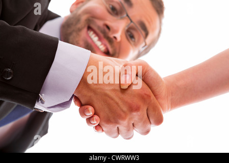 Happy and smiling businessman sealing a successful deal with a handshake. Stock Photo